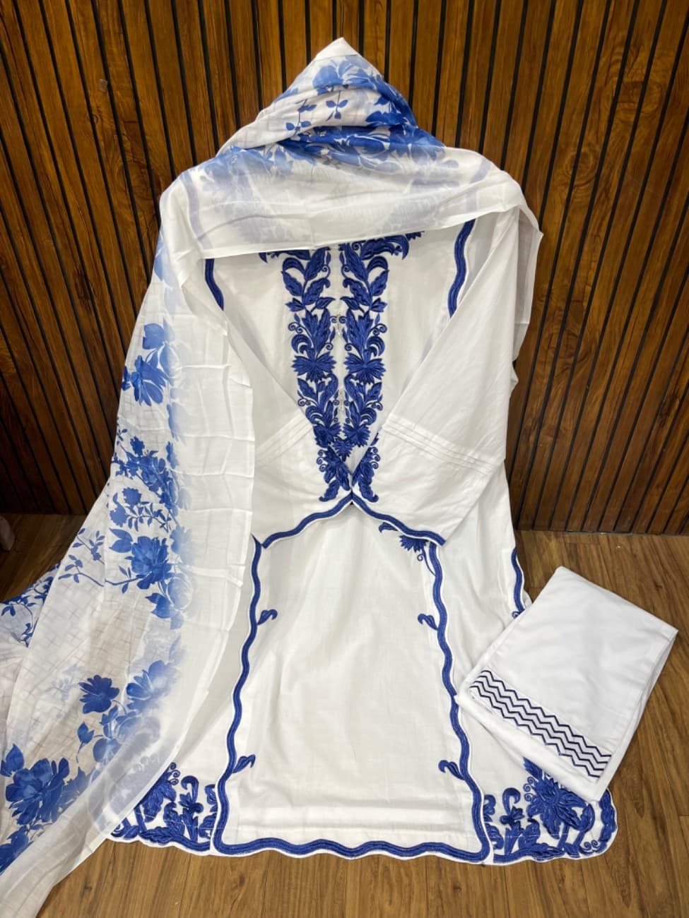 This stunning  white blue suit features elegant black heavy embroidery