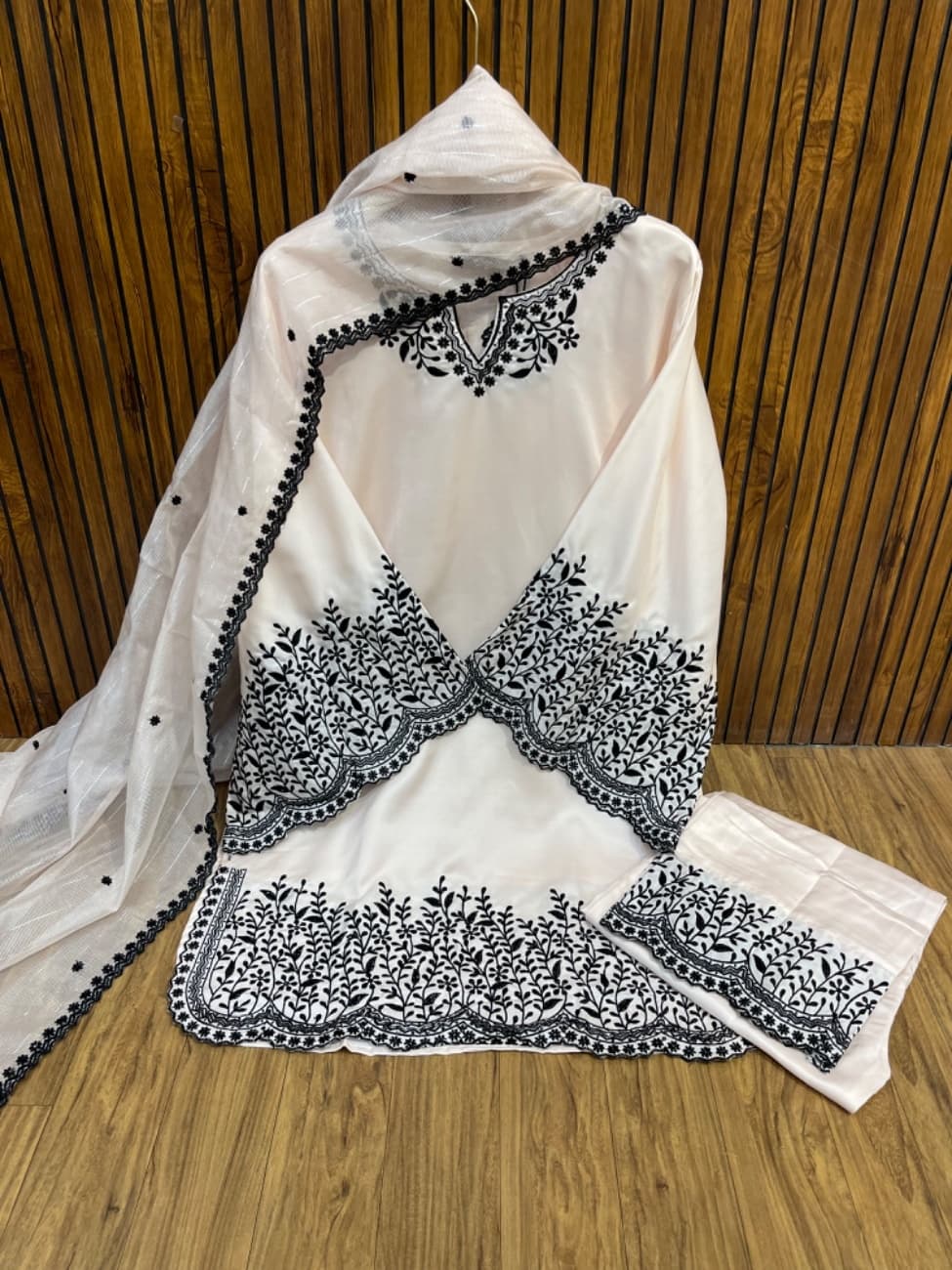 Pearl white and black colour combination with elegant heavy floral vine embroidery work