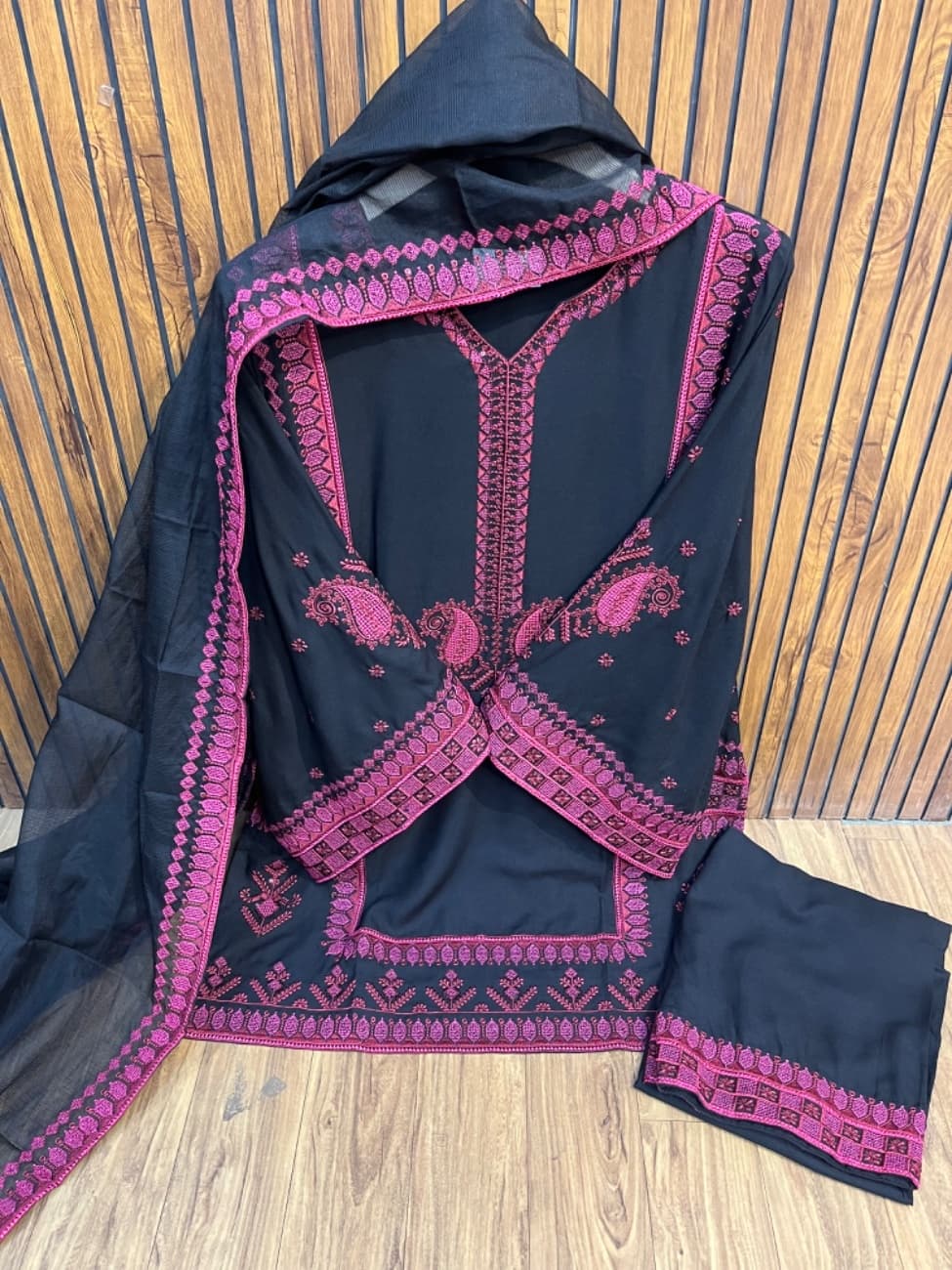 Black magenta pink thread embroidery work with a classy ethnic design.