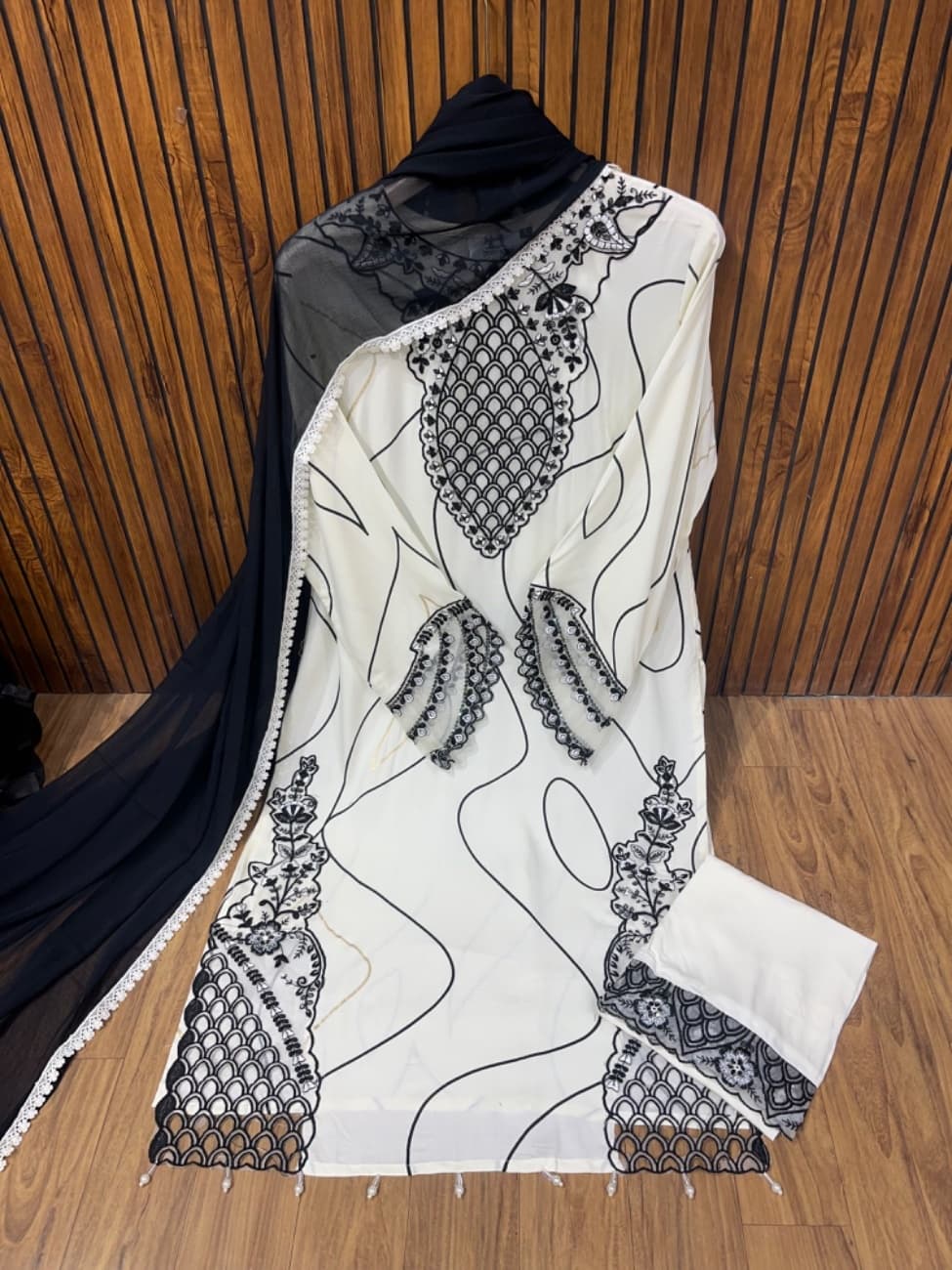White and Black rayon suit with neck cutwork and daman cutwork with comfortable pant with pattern