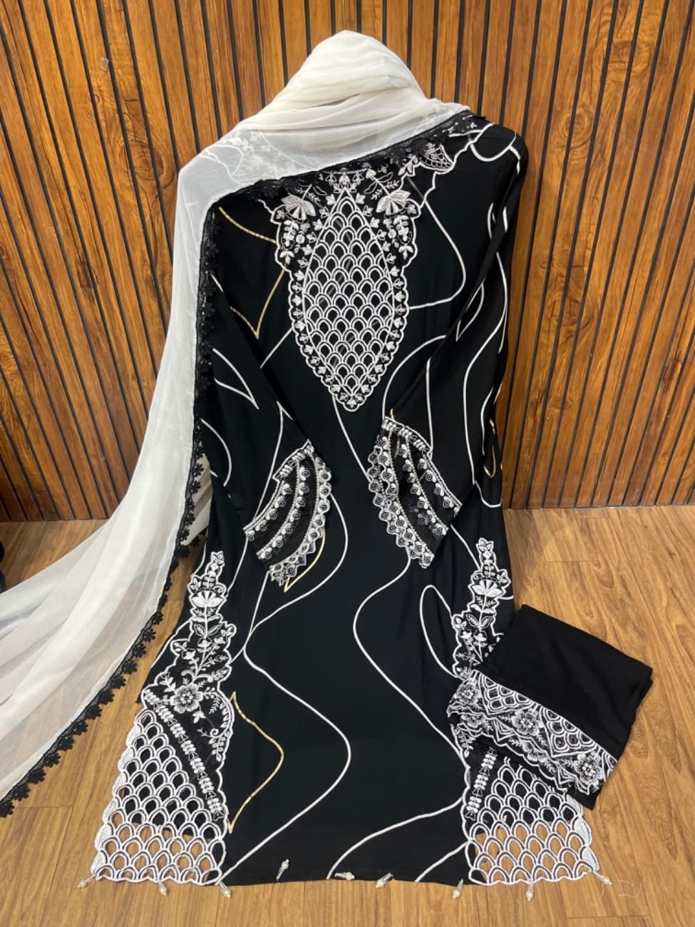 Black and white rayon suit with neck cutwork and daman cutwork with comfortable pant with pattern